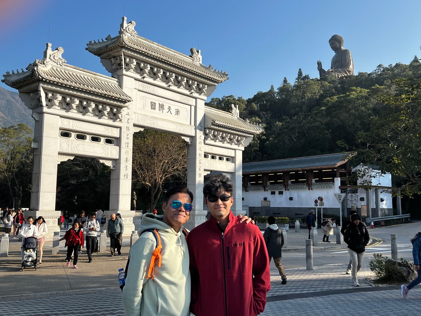 Naman at the gate below the Big Buddha in Hong Kong
