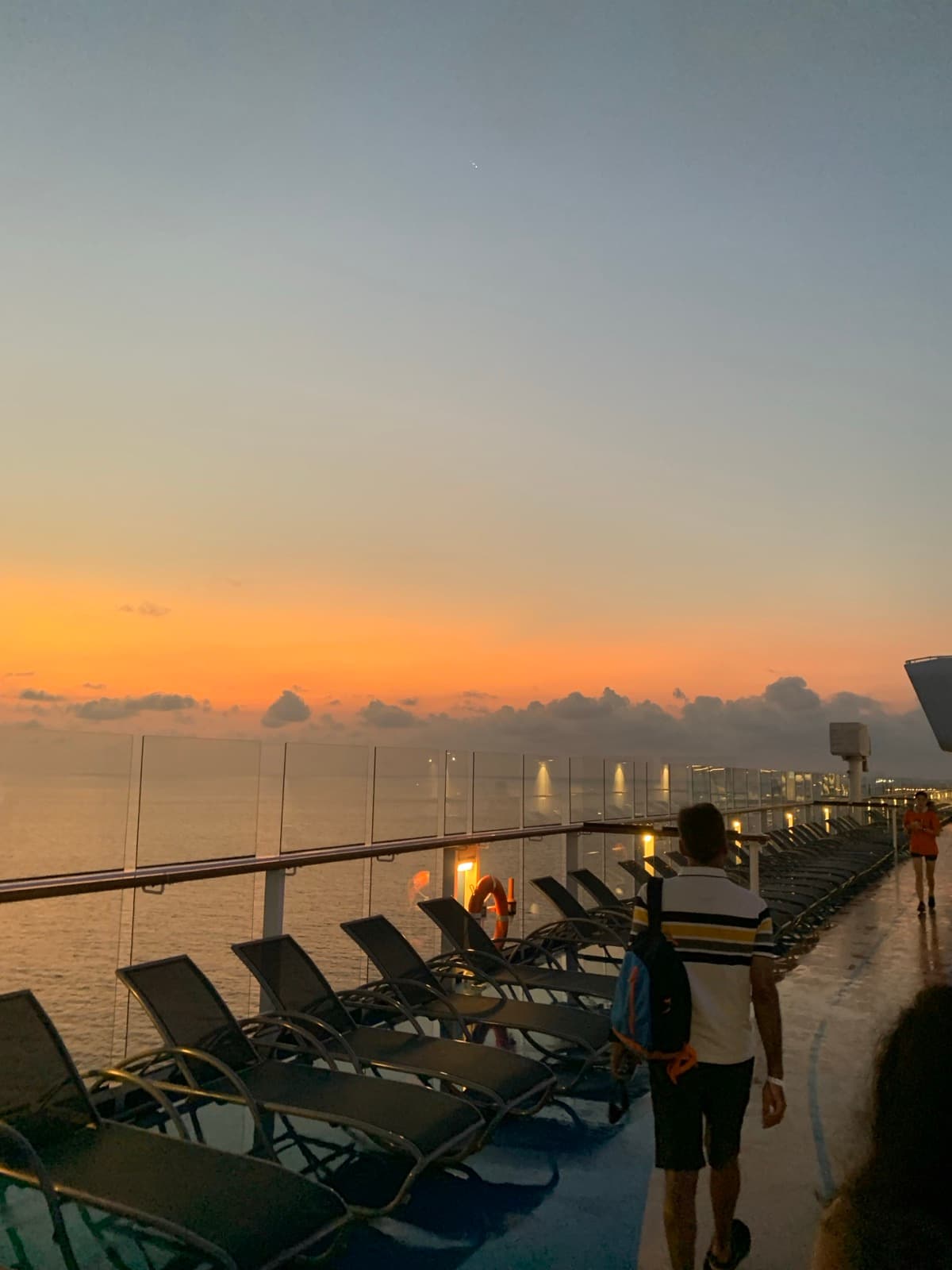 Sunset over the sea from a ship's top deck
